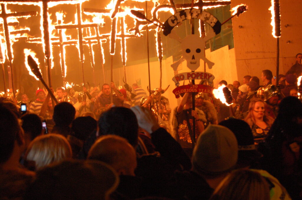 To celebrate Guy Fawkes Day crosses are burned in Lewes to commemorate the Lewes Martyrs, 17 Protestant martyrs burned in the 16th c. during the reign of the Catholic Queen Mary.
