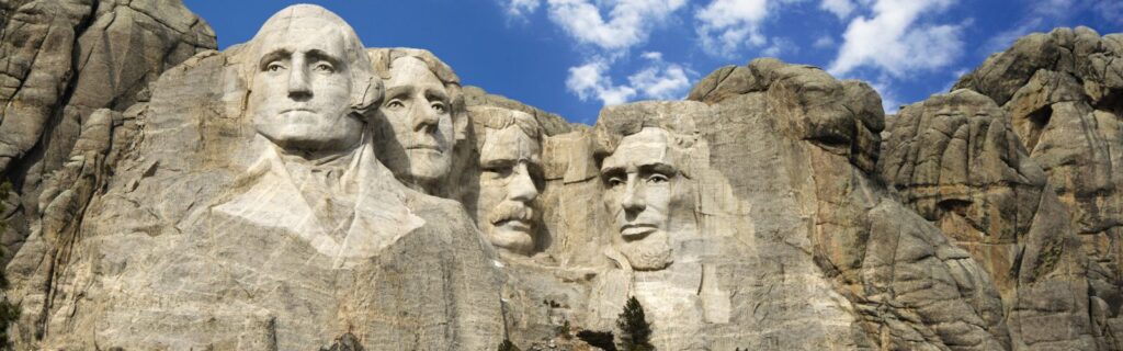 Mount Rushmore with blue skies above